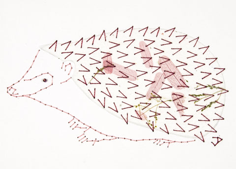 Hedgehog in Pale Wine Leaves on White