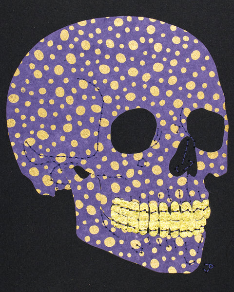 Skull in gold dots on purple
