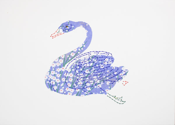 Swan in periwinkle reeds