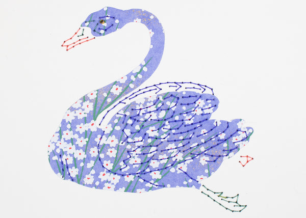 Swan in periwinkle reeds