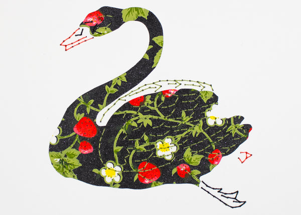 Swan in strawberries on black
