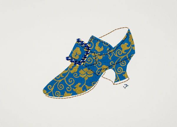 Hand-stitched 1760s shoe in blue paper patterned with bronze flowers and vines and accented with a rhinestone buckle
